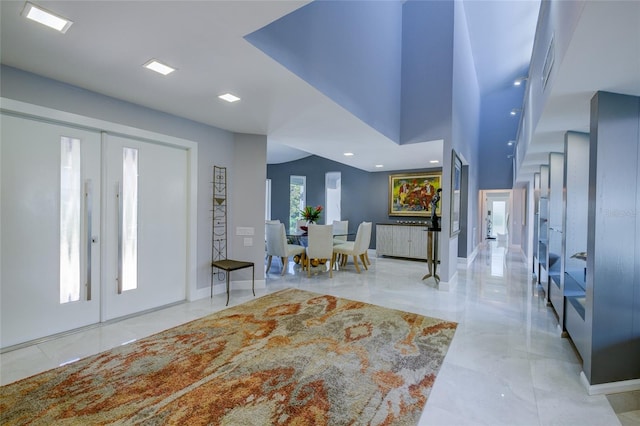 foyer with french doors and light tile flooring