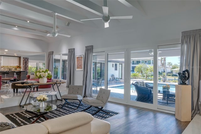 living room featuring high vaulted ceiling, wood-type flooring, ceiling fan, and beamed ceiling