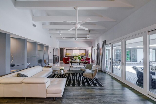 living room featuring vaulted ceiling with beams, ceiling fan, and dark hardwood / wood-style flooring