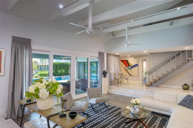 living room featuring hardwood / wood-style floors, high vaulted ceiling, ceiling fan, and beamed ceiling