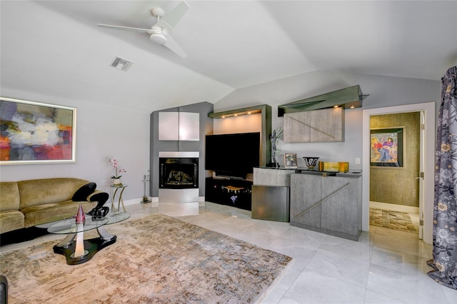 kitchen with vaulted ceiling, ceiling fan, and light tile flooring