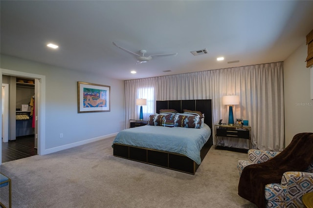 bedroom featuring light carpet and ceiling fan