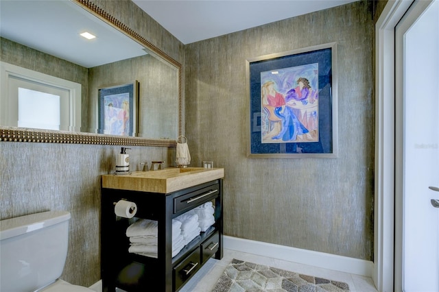 bathroom with vanity, tile flooring, and toilet