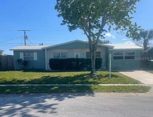 ranch-style home with a front lawn