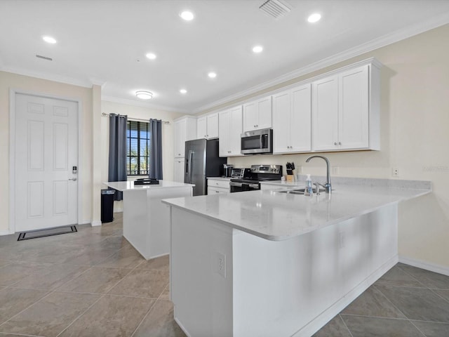 kitchen with sink, light stone counters, white cabinets, stainless steel appliances, and light tile flooring