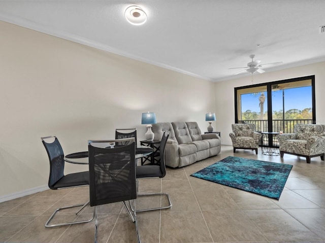 tiled living room featuring crown molding and ceiling fan