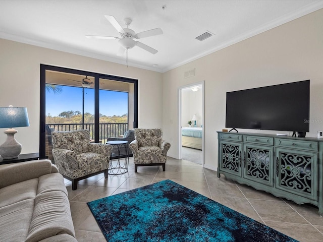 tiled living room featuring ornamental molding and ceiling fan