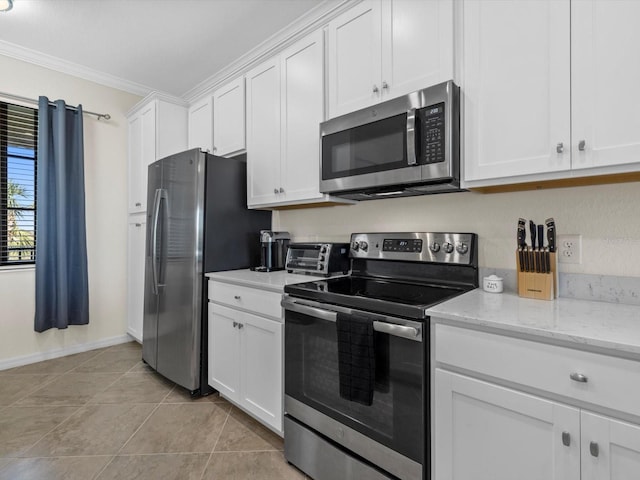 kitchen with crown molding, white cabinets, appliances with stainless steel finishes, and light stone counters