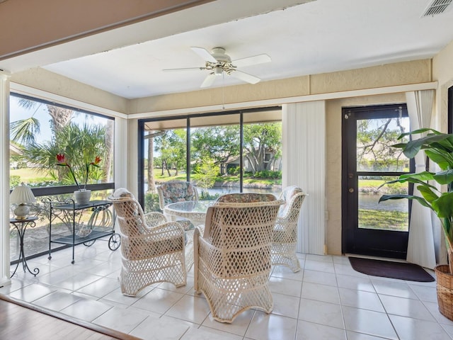 sunroom / solarium with ceiling fan