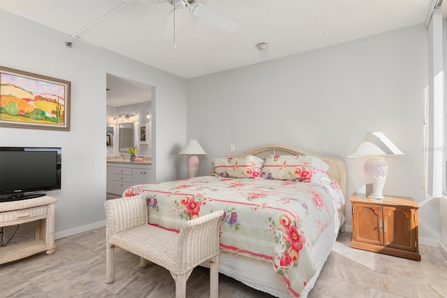 tiled bedroom featuring ensuite bath and ceiling fan