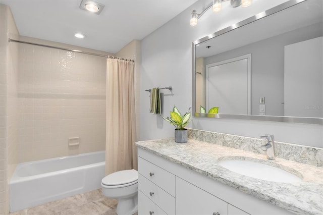 full bathroom featuring shower / bath combo with shower curtain, toilet, large vanity, and tile floors