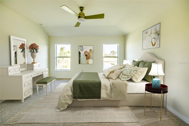 bedroom with ceiling fan, vaulted ceiling, and light colored carpet