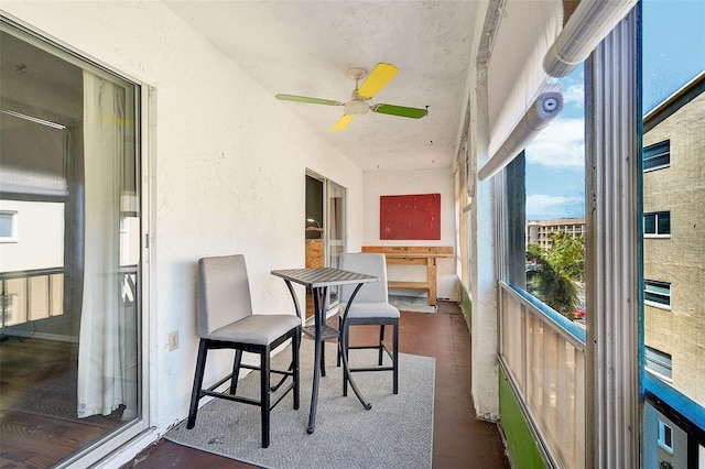 sunroom / solarium with ceiling fan