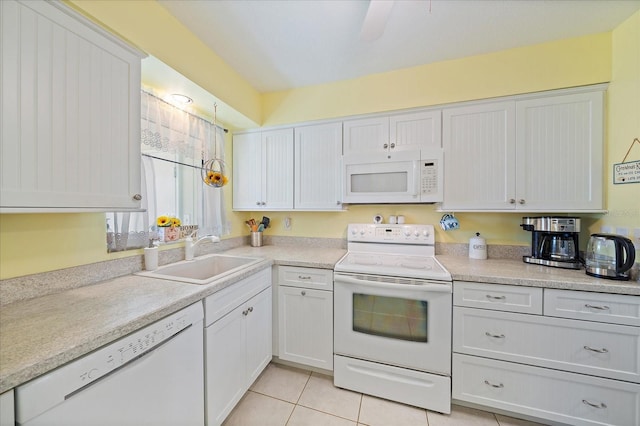 kitchen featuring light tile floors, ceiling fan, white appliances, white cabinets, and sink