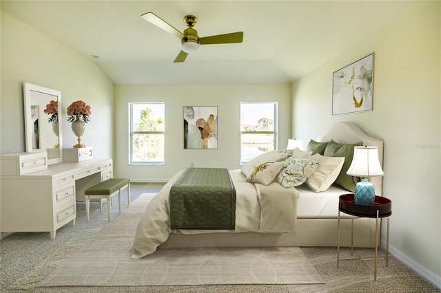 carpeted bedroom with ceiling fan and vaulted ceiling