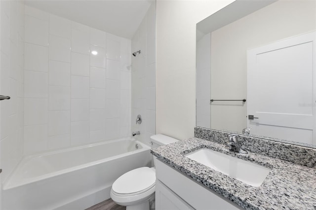 full bathroom featuring wood-type flooring, toilet, shower / tub combination, and vanity