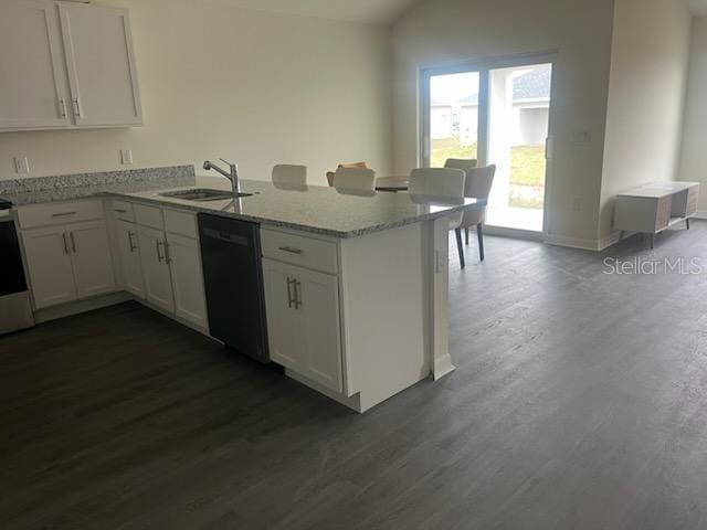 kitchen with a sink, light stone countertops, black dishwasher, a peninsula, and dark wood-style flooring