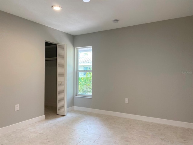 unfurnished bedroom featuring a closet