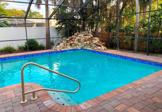 view of pool with a lanai