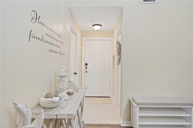 entryway with light hardwood / wood-style floors