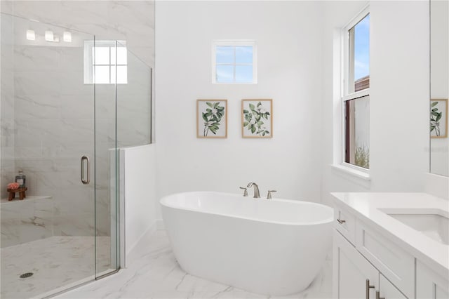 bathroom with vanity and separate shower and tub