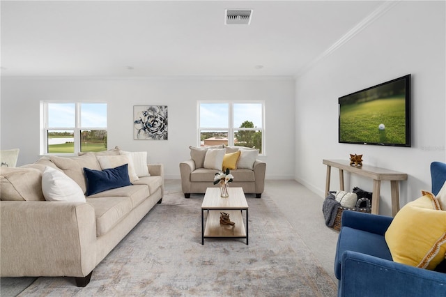 carpeted living room with ornamental molding