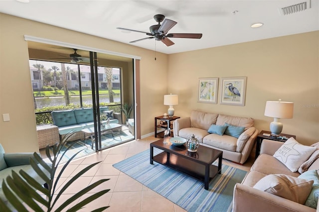 living room with ceiling fan and light tile floors