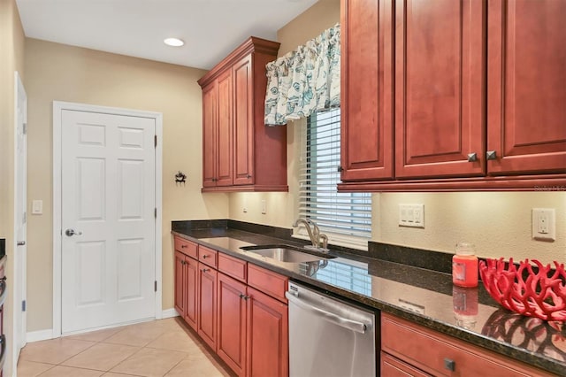 kitchen with dishwasher, sink, dark stone countertops, and light tile floors