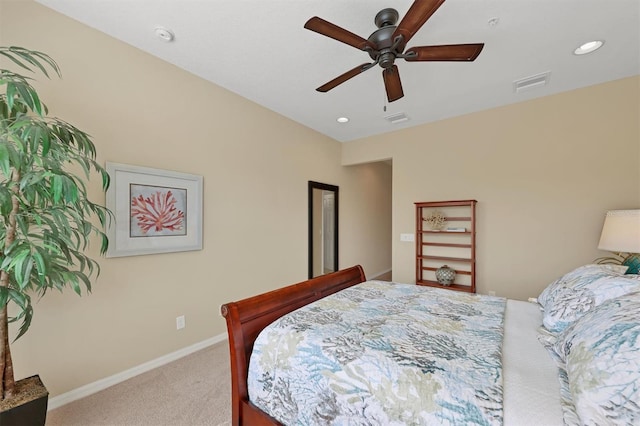 bedroom with ceiling fan and light carpet