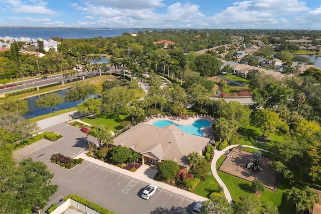 birds eye view of property with a water view