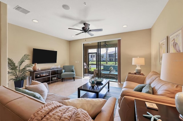 living room with light tile floors and ceiling fan