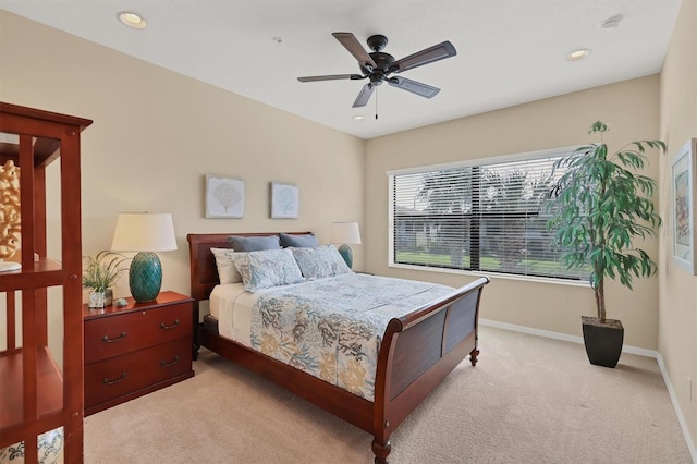 bedroom featuring ceiling fan and light colored carpet