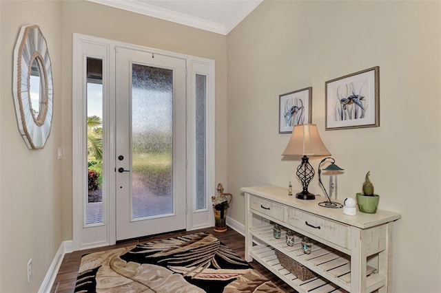 foyer with dark hardwood / wood-style floors and ornamental molding