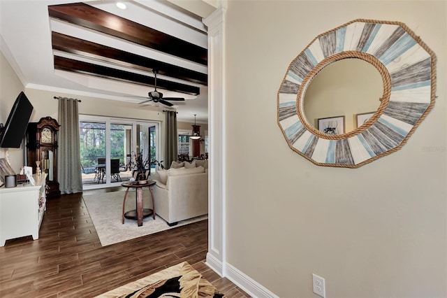 living room featuring crown molding, ceiling fan, dark hardwood / wood-style flooring, and beamed ceiling