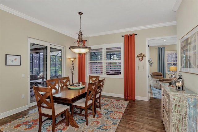 dining space featuring dark wood-type flooring and ornamental molding