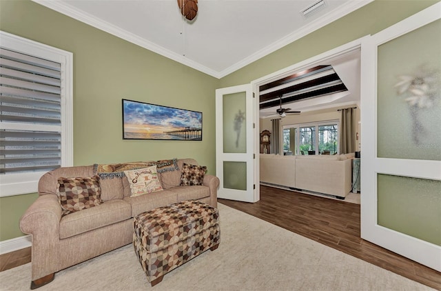 living room featuring crown molding, french doors, dark hardwood / wood-style flooring, and ceiling fan