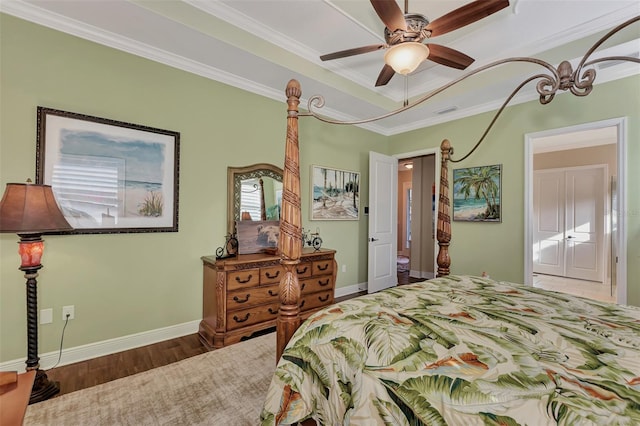 bedroom featuring ornamental molding, ceiling fan, and dark hardwood / wood-style floors