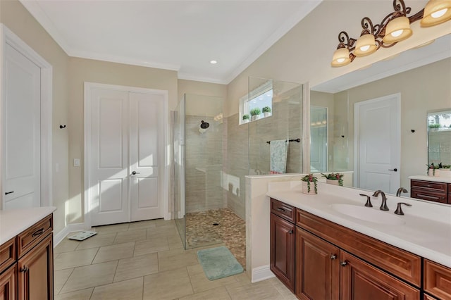 bathroom with walk in shower, plenty of natural light, tile floors, and vanity