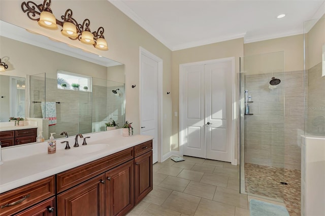 bathroom with vanity, tile floors, a shower with shower door, and crown molding