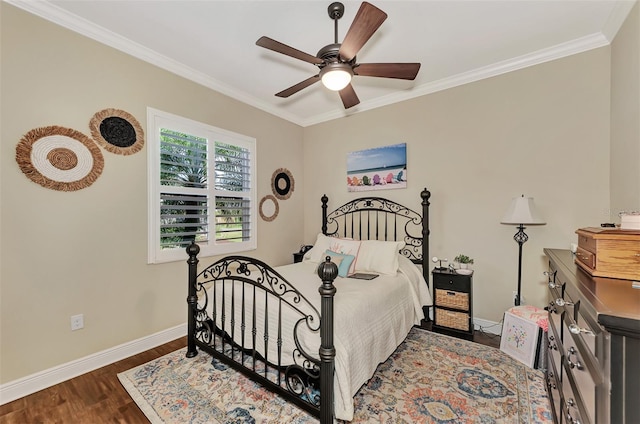 bedroom featuring crown molding, dark hardwood / wood-style floors, and ceiling fan