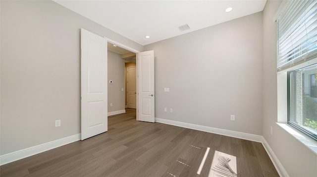 spare room featuring hardwood / wood-style floors