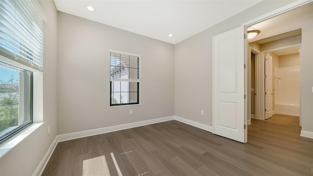 empty room featuring hardwood / wood-style flooring