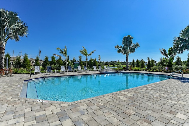 view of swimming pool with a patio