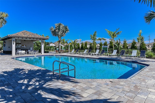 view of swimming pool featuring a patio area