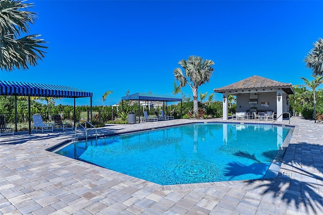 view of pool featuring a patio and a gazebo