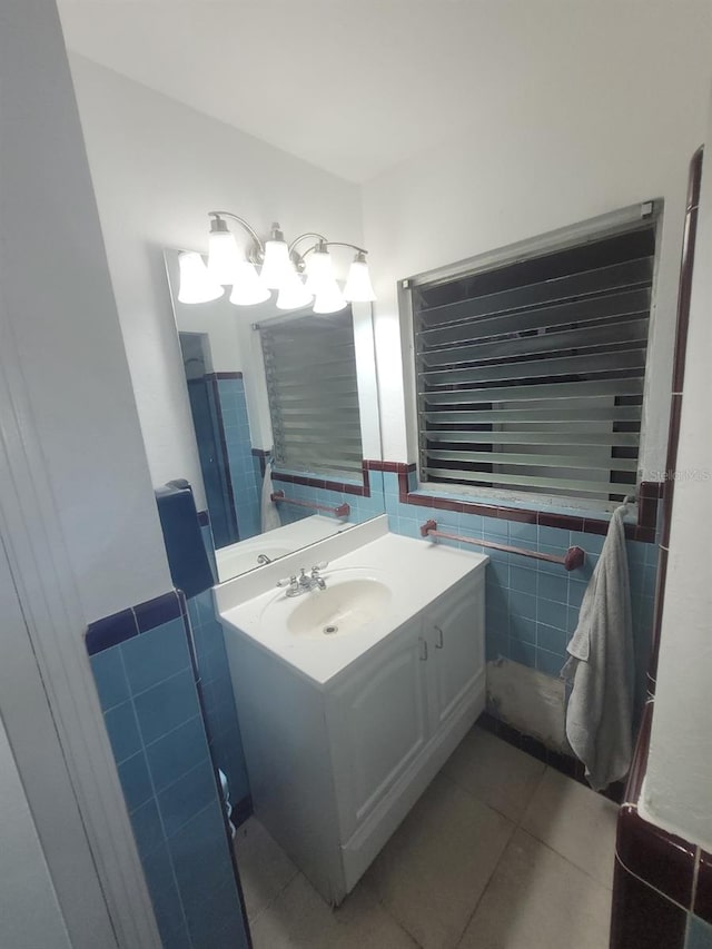 bathroom featuring tile walls, tile floors, and vanity