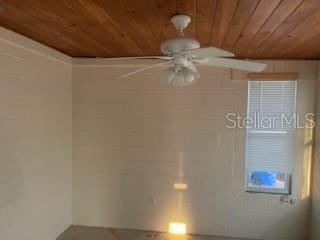 711A Pineland Ave, Venice, FL 34285 - empty room with wooden ceiling and a ceiling fan