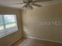 711A Pineland Ave, Venice, FL 34285 - unfurnished room with baseboards and ceiling fan