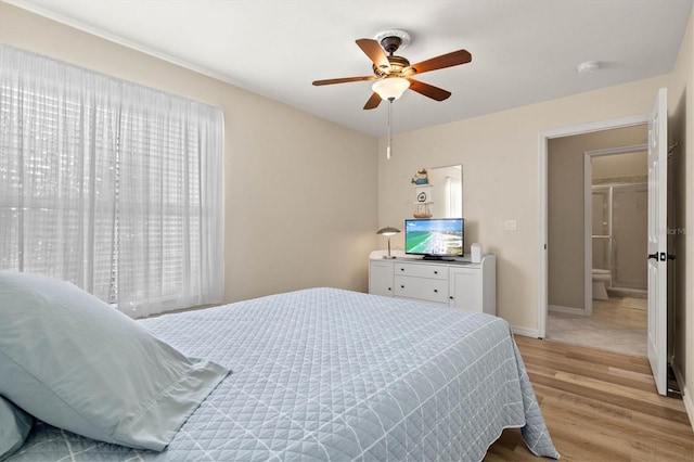 bedroom featuring ceiling fan, light wood finished floors, and baseboards