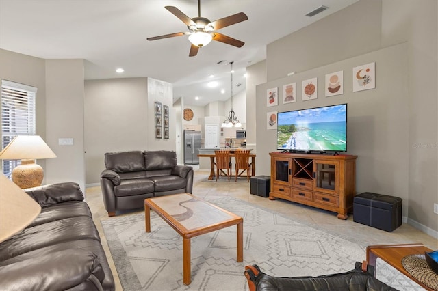 living area featuring ceiling fan, light tile patterned floors, recessed lighting, visible vents, and baseboards